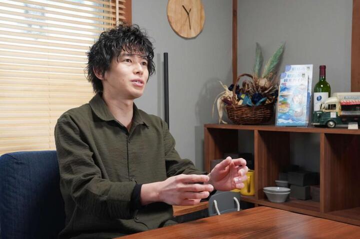 写真：お話しする中出さん